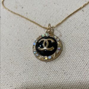 CHANEL Gold iridescent & Black Pendant/Charm